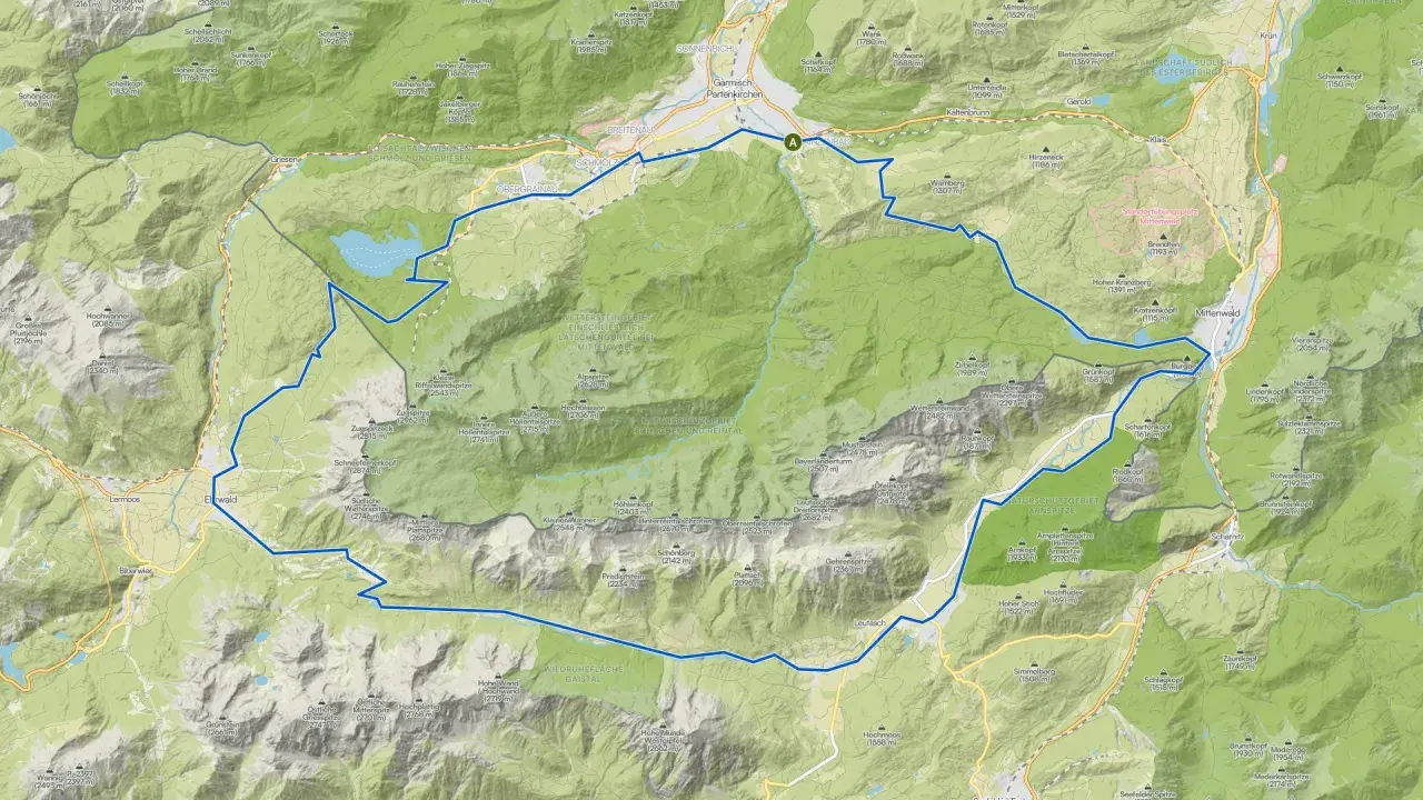 Eine MTB-Tour-Route schlängelt sich durch die beeindruckende Berglandschaft von Garmisch-Partenkirchen, vorbei an Gipfeln wie Zugspitze und Alpspitze.