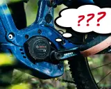 Fragezeichen über dem Bosch CX Gen 4 Motor am E-Bike. Wie kann man den Bosch CX Gen 4 leiser machen?