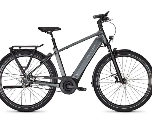 Graues Kalkhoff Image 5.b Advance+ E-Bike mit Gepäckträger und Riemenantrieb, bereit für den Test.
